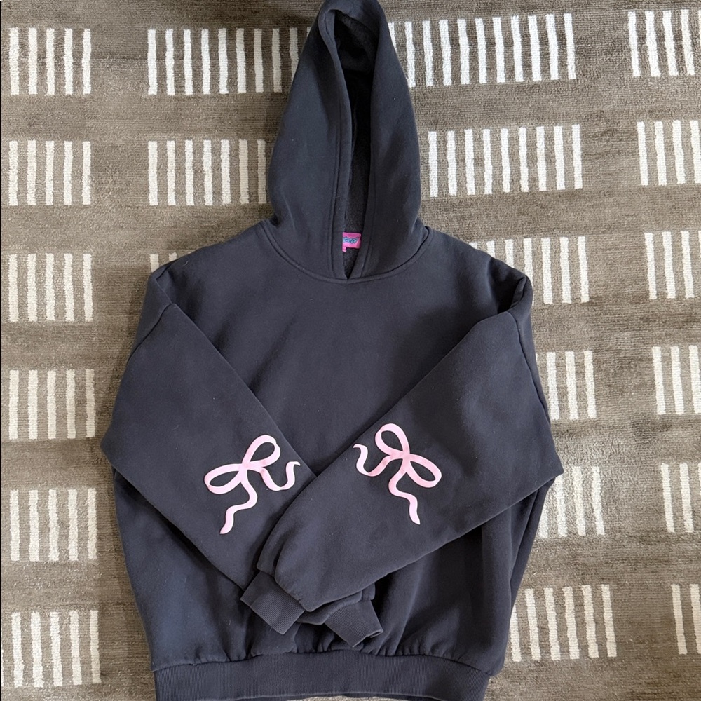 Edikted Dark Gray Hoodie with Pink bows on the sleeves.